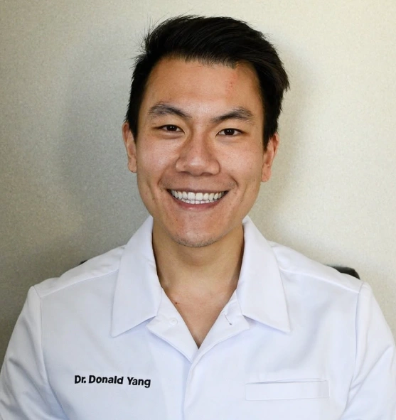 Dr. Donald Yang smiling in a professional portrait