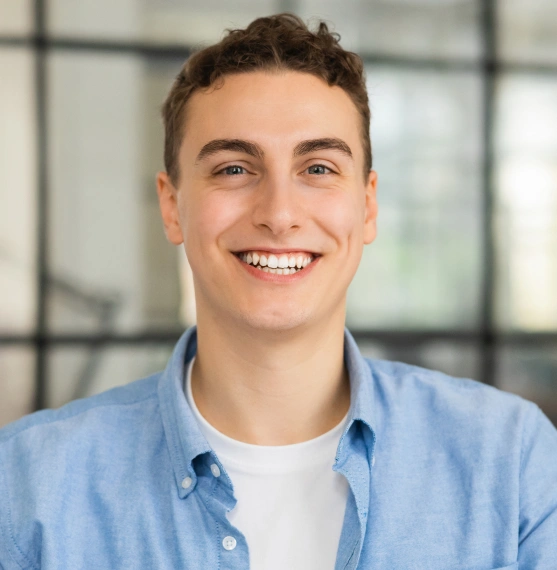 Young man smiling after treatment at Broadway Dental of Millbrae