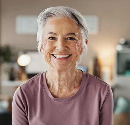 Older woman looking at camera and smiling