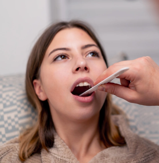 Dentist performing an oral cancer screening