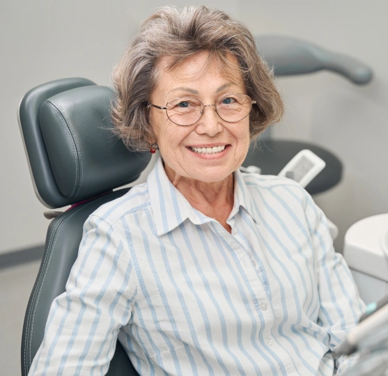Older woman sitting in a dental chair
