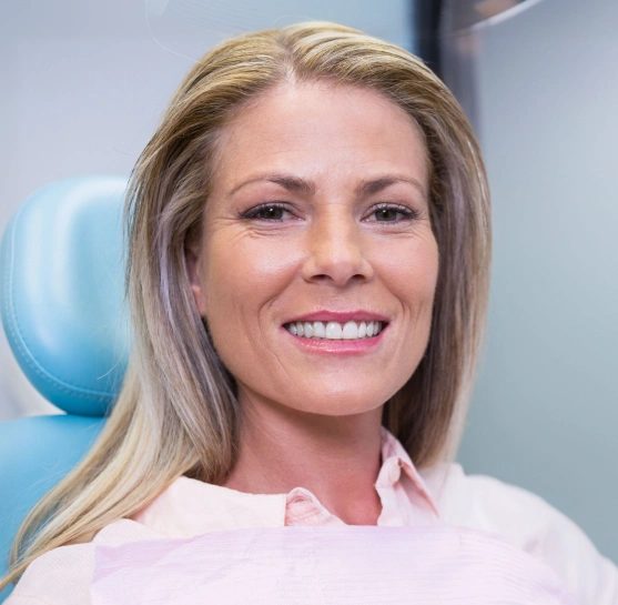 Woman smiling while being treated at Broadway Dental of Millbrae